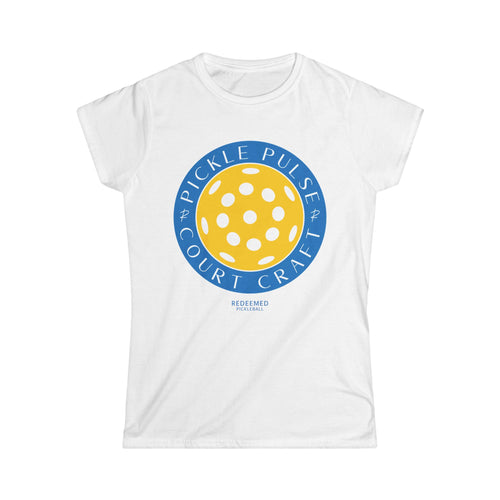 A white women's t-shirt with a round graphic design in the center that features text and a pickleball pattern.