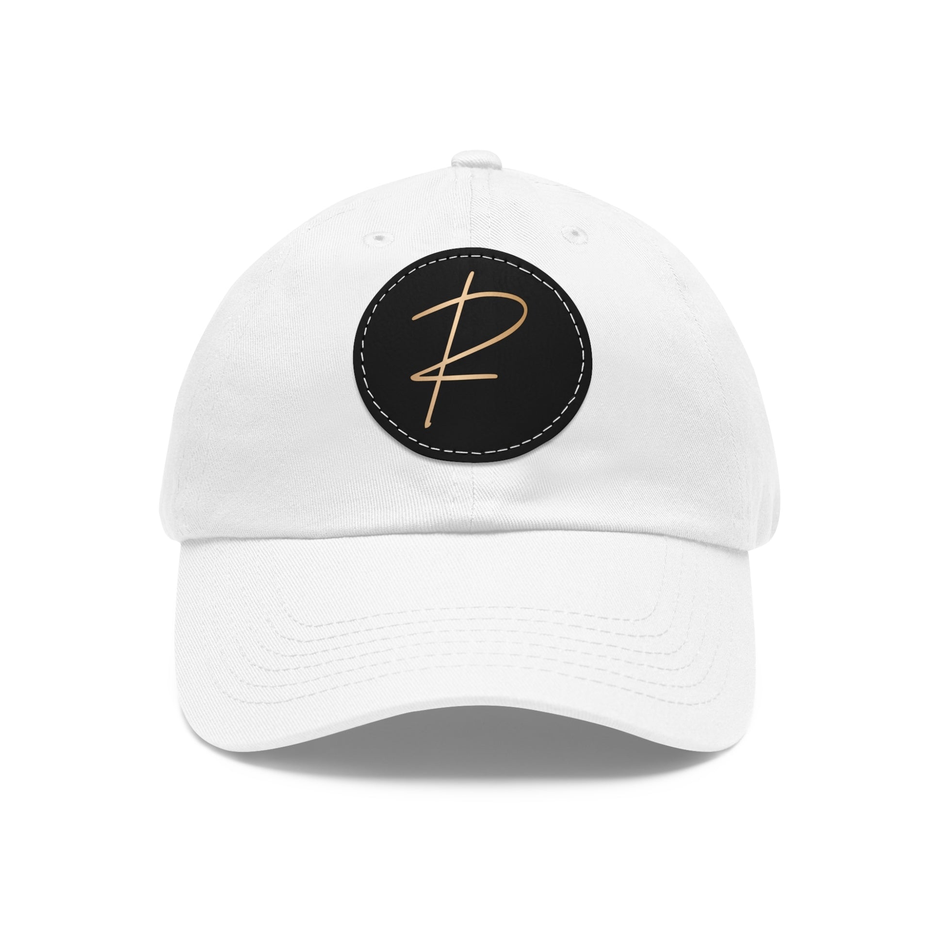 A white, unstructured, six-panel low-profile pickleball hat with a leather patch on the front featuring the letter 'R' in a darker color.